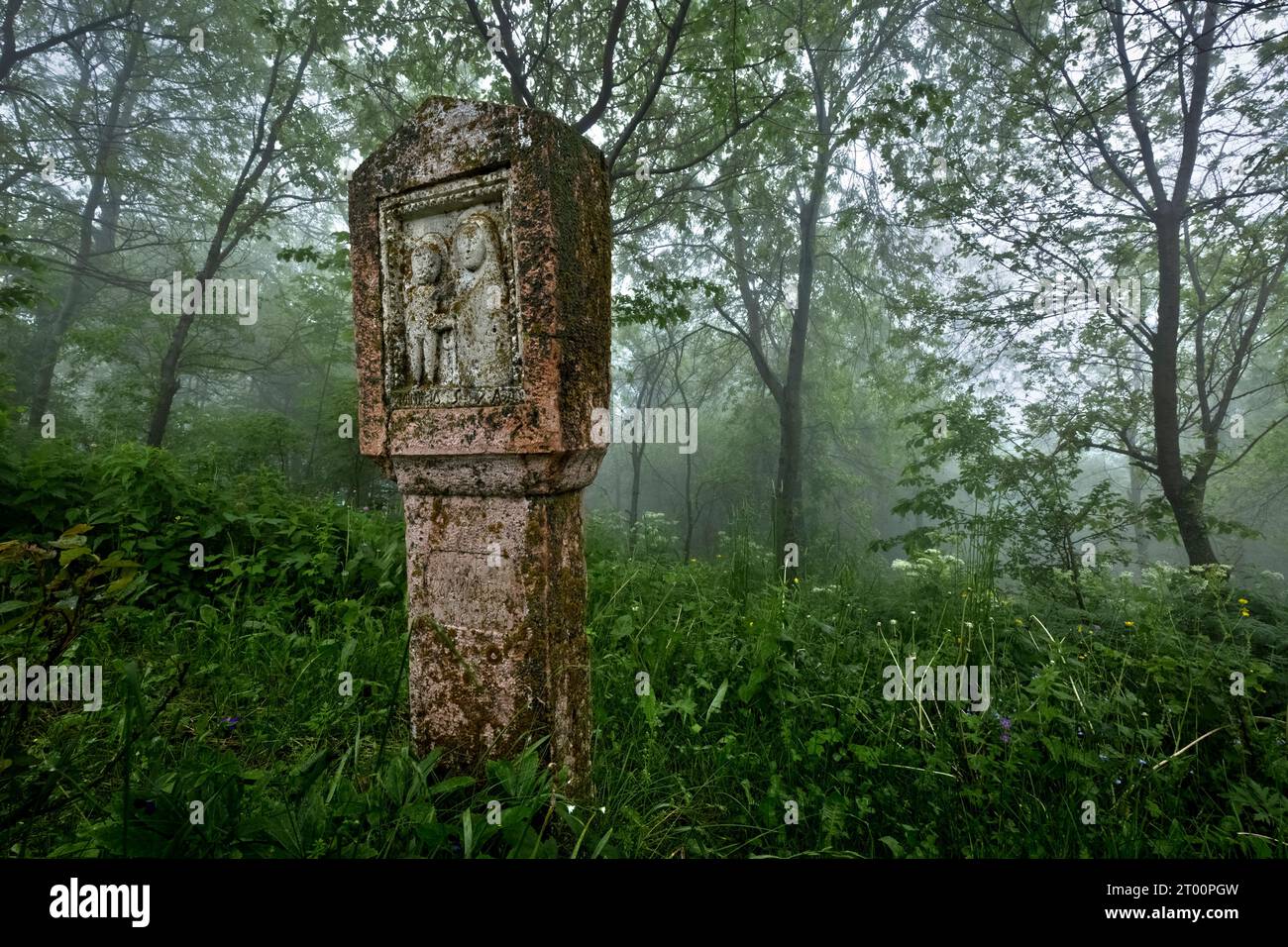 Christian stele in the woods near the village of Pagani. Campofontana, Selva di Progno, Lessinia, Veneto, Italy. Stock Photo