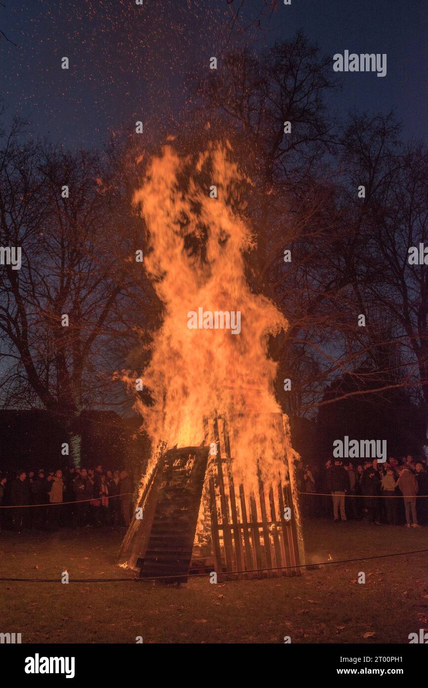 Winchester College annual Illumina Ceremony. End of the Autumn Term, a bonfire is lit as it goes down the choir sing the school song Domum. Winchester, Hampshire, England  9th December 2022. 2020s UK HOMER SYKES. Stock Photo