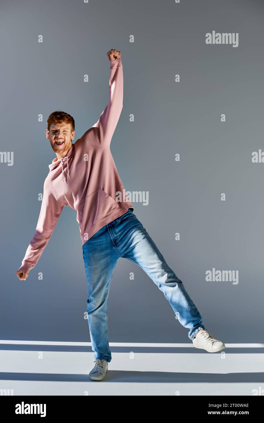 Young man standing one leg hi-res stock photography and images - Alamy