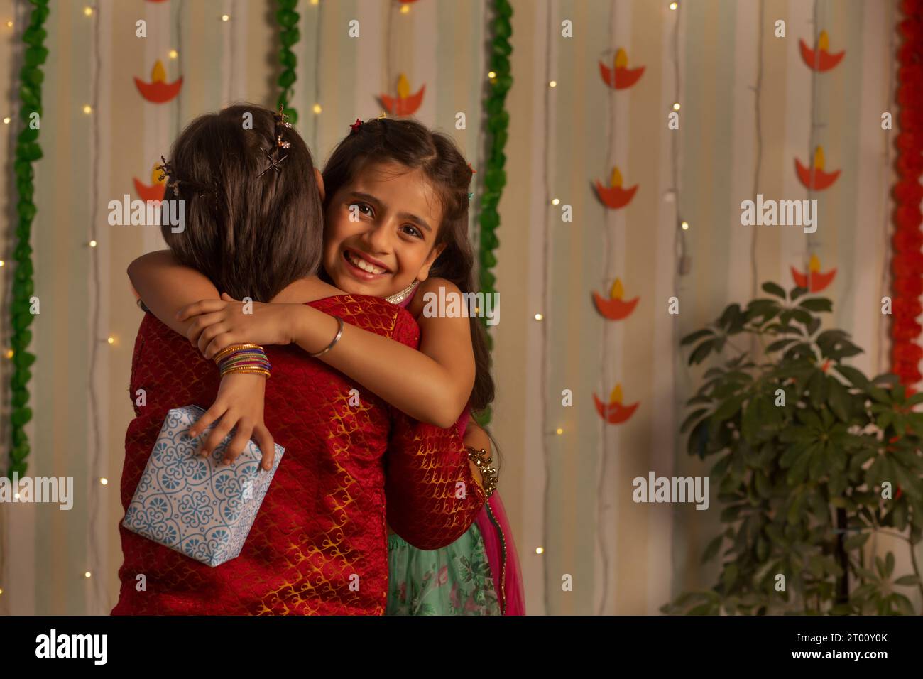 Two little girls embracing each other on the occasion of Diwali Stock ...