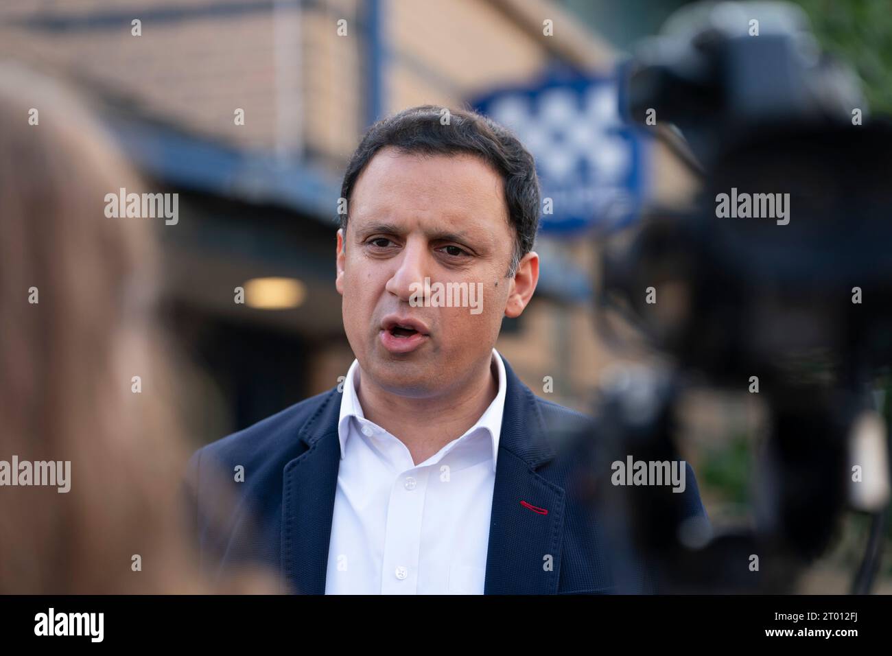 Cambuslang, Scotland, UK. 3rd October 2023. Scottish Labourr leader Anas Sarwar and candidate for the Rutherglen and Hamilton West by-election Michael Shanks campaigning in Cambuslang today. Sarwar chose to be interviewed outside Cambuslang Police Station, which was closed, to highlight SNP policies to shut all the police stations in the constituency. The Scottish Labour Party is hoping to take the seat from the SNP. The by-election is on 5 October 2023.  Iain Masterton/Alamy Live News Stock Photo