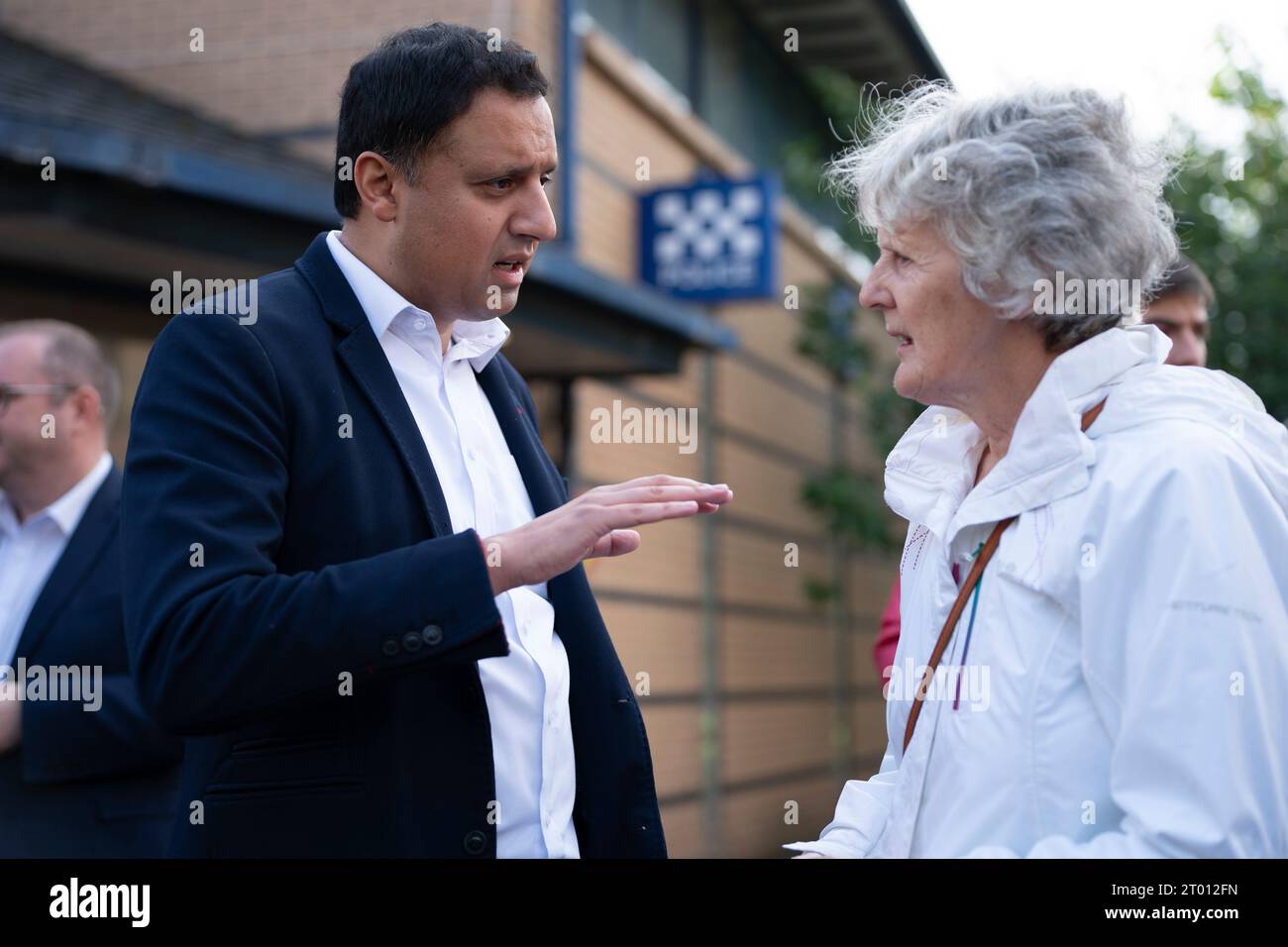 Cambuslang, Scotland, UK. 3rd October 2023. Scottish Labourr leader Anas Sarwar and candidate for the Rutherglen and Hamilton West by-election Michael Shanks campaigning in Cambuslang today. Sarwar chose to be interviewed outside Cambuslang Police Station, which was closed, to highlight SNP policies to shut all the police stations in the constituency. The Scottish Labour Party is hoping to take the seat from the SNP. The by-election is on 5 October 2023.  Iain Masterton/Alamy Live News Stock Photo