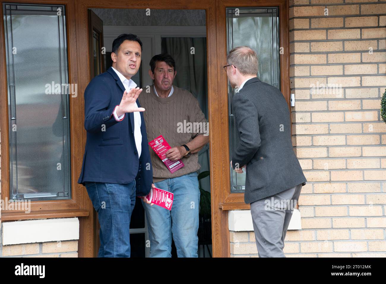 Cambuslang, Scotland, UK. 3rd October 2023. Scottish Labourr leader Anas Sarwar and candidate for the Rutherglen and Hamilton West by-election Michael Shanks campaigning in Cambuslang today. Sarwar chose to be interviewed outside Cambuslang Police Station, which was closed, to highlight SNP policies to shut all the police stations in the constituency. The Scottish Labour Party is hoping to take the seat from the SNP. The by-election is on 5 October 2023.  Iain Masterton/Alamy Live News Stock Photo