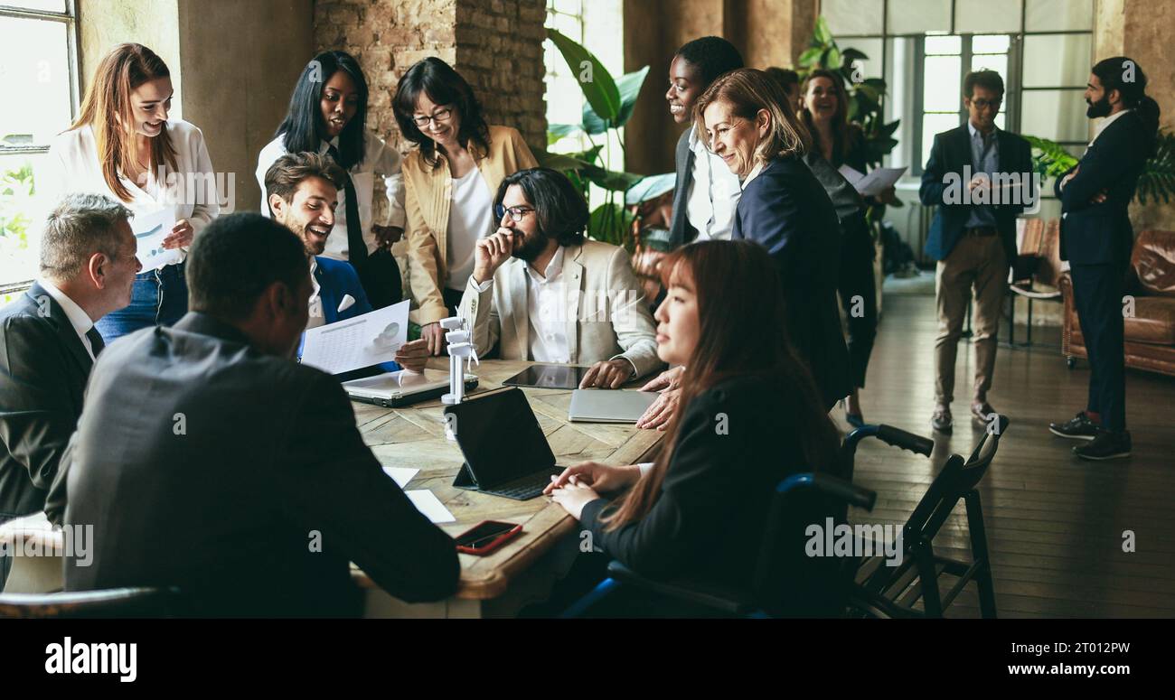 Multiracial business people working on sustainable innovation project - Green renewable energy concept - Focus on right senior woman face Stock Photo