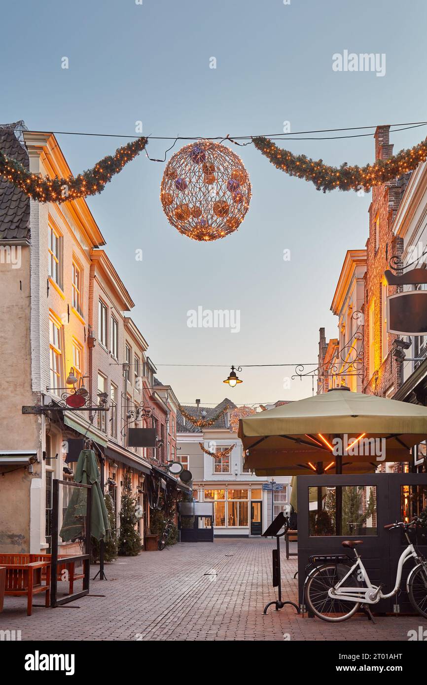 Bars and restaurants with christmas decoration in the famous Korte Putstraat street in the city center of Den Bosch, The Netherlands Stock Photo