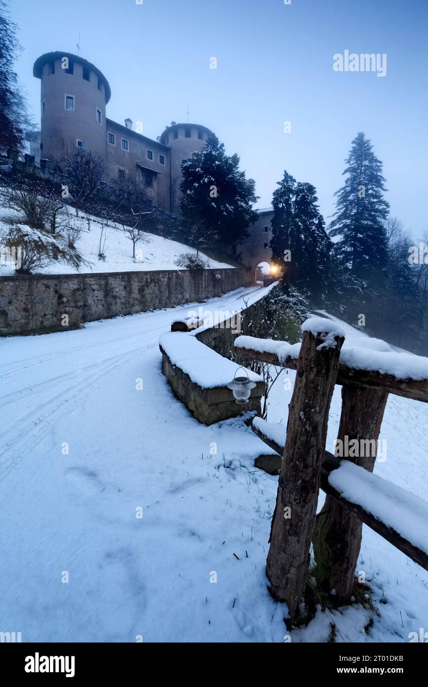 The medieval castle of Campo in snowy winter. Campo Lomaso, Giudicarie, Trentino, Italy. Stock Photo