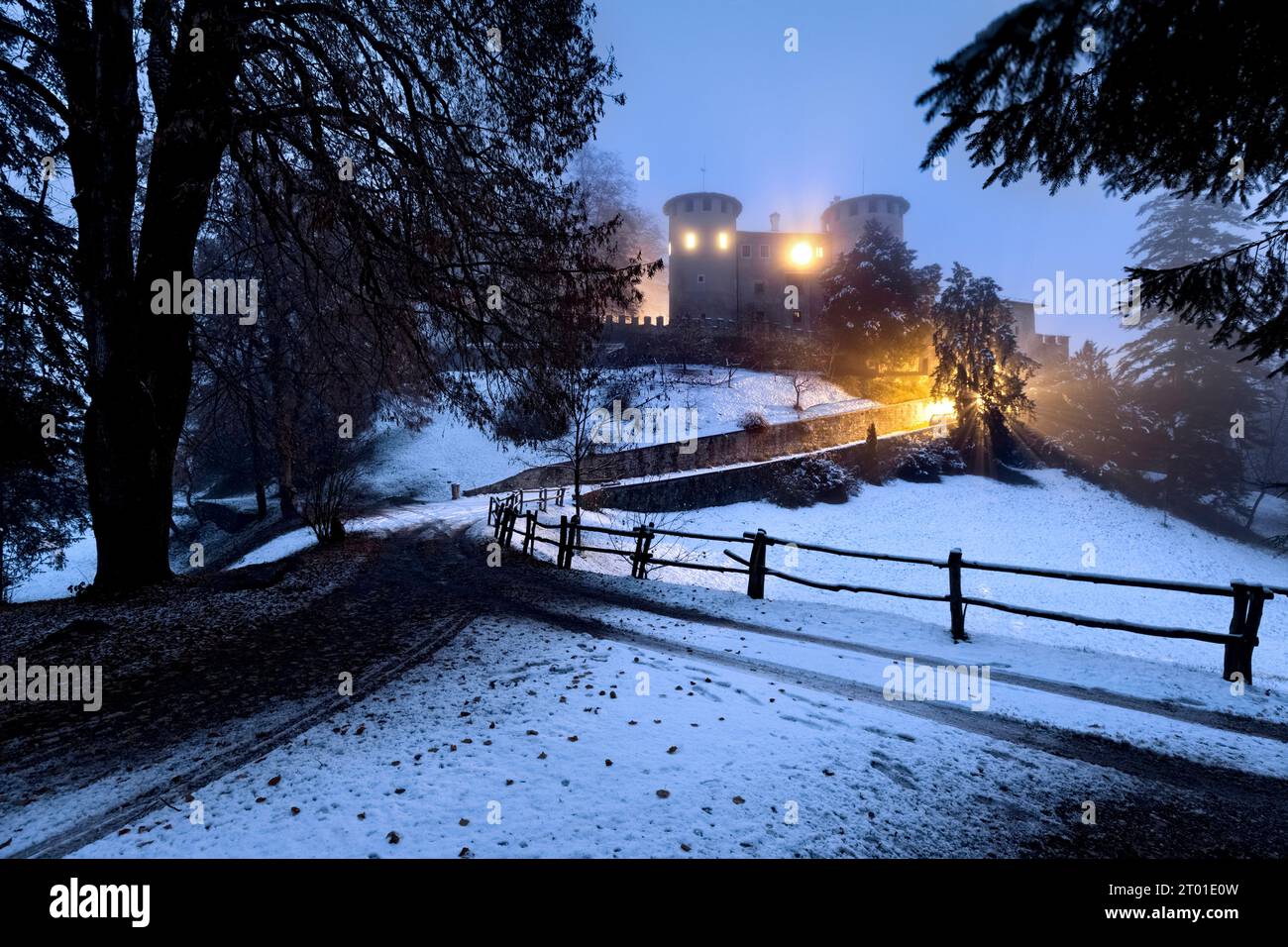 The Campo castle on a fairytale winter evening. Campo Lomaso, Giudicarie, Trentino, Italy. Stock Photo