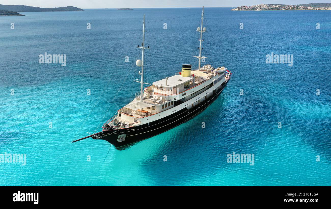 Aerial drone view of luxury yacht MY Casablanca in Croatia (Barbara Cruising), beautiful small classic cruise ship, Adriatic Sea turquoise blue water Stock Photo