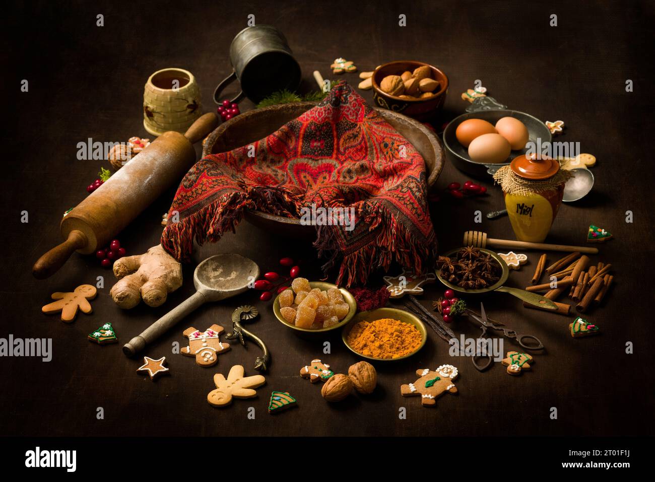 Vintage still life of Christmas gingerbread cookies and their ingredients arranged in a colourful circle Stock Photo