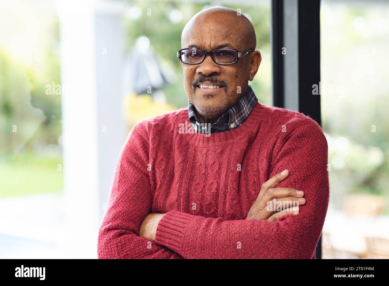 Portrait of smiling young man wearing glasses hi-res stock photography ...