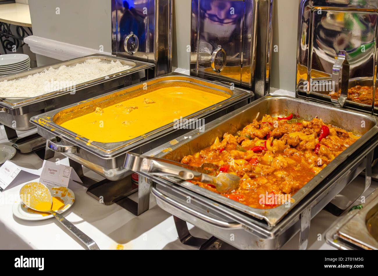 Hot food at a self service buffet kept warm in chafing dishes at a