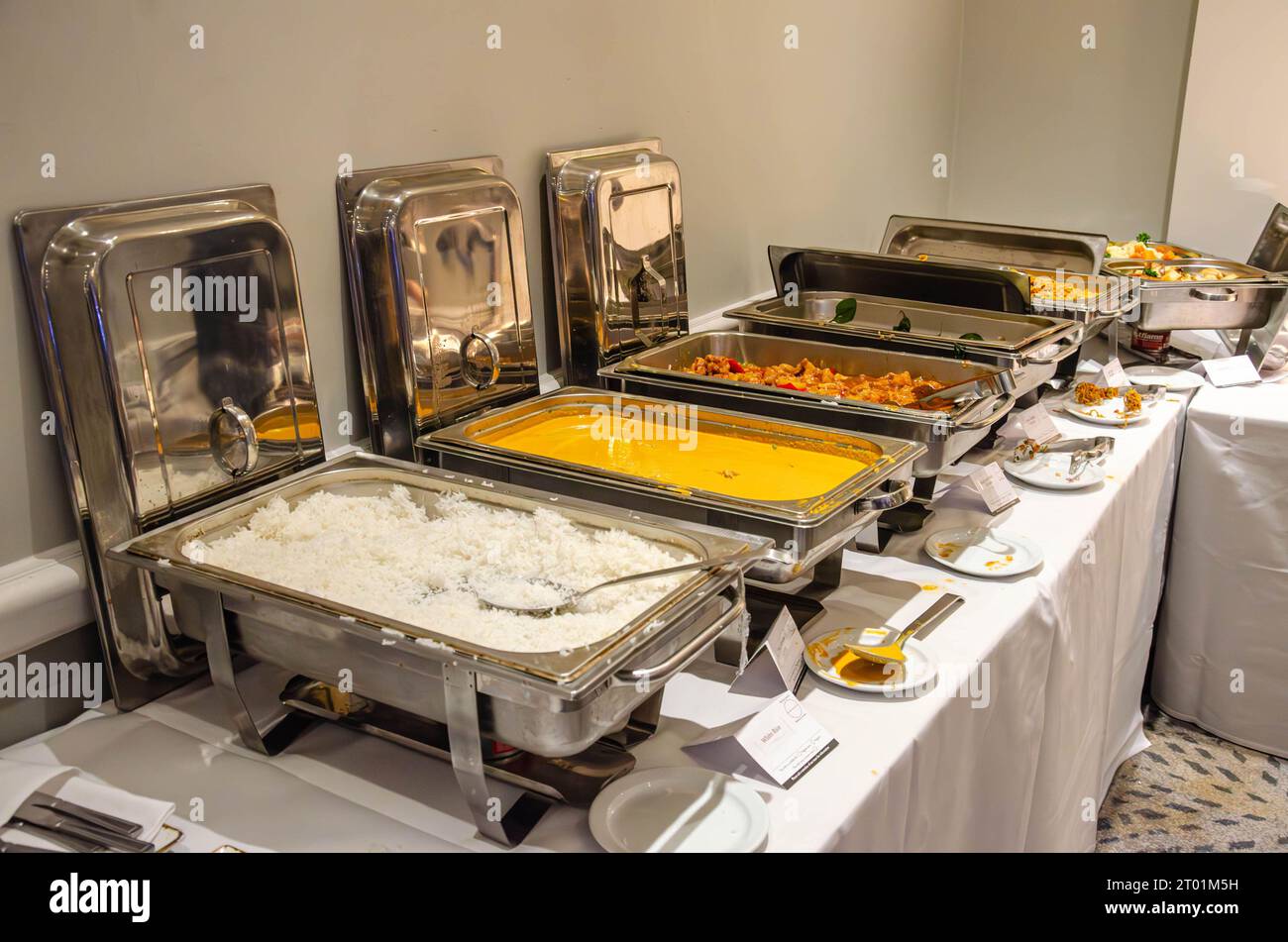 Hot food at a self service buffet kept warm in chafing dishes at a