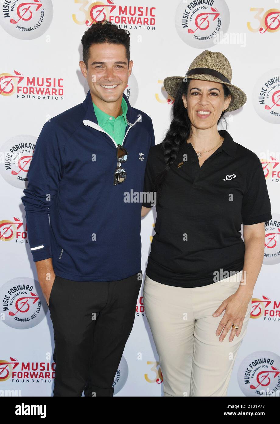 TARZANA, CALIFORNIA - OCTOBER 02: (L-R) Wells Adams and Nurit Siegel Smith attend the Music Forward Foundation Golf Classic at El Caballero Country Cl Stock Photo