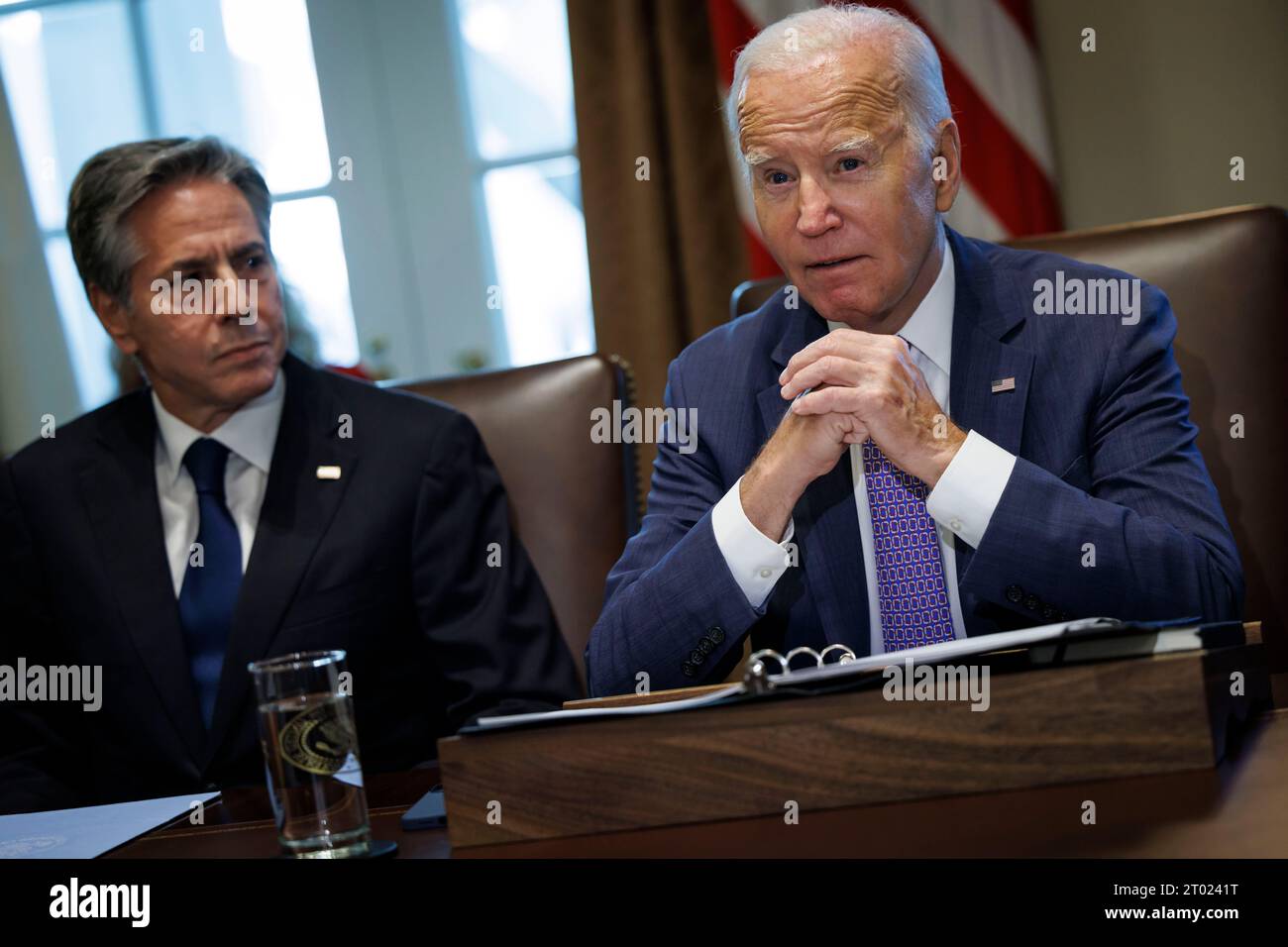 United States President Joe Biden speaks during a cabinet meeting at the White House in Washington, DC, US, on Monday, October 2, 2023. On Saturday, Congress passed a bipartisan measure that would keep the US government funded until Nov. 17 with $16 billion in disaster funding, however the lack of $6 billion in Ukraine aid is a blow to Biden. Looking on at left is US Secretary of State Antony Blinken. Credit: Ting Shen / Pool via CNP Stock Photo