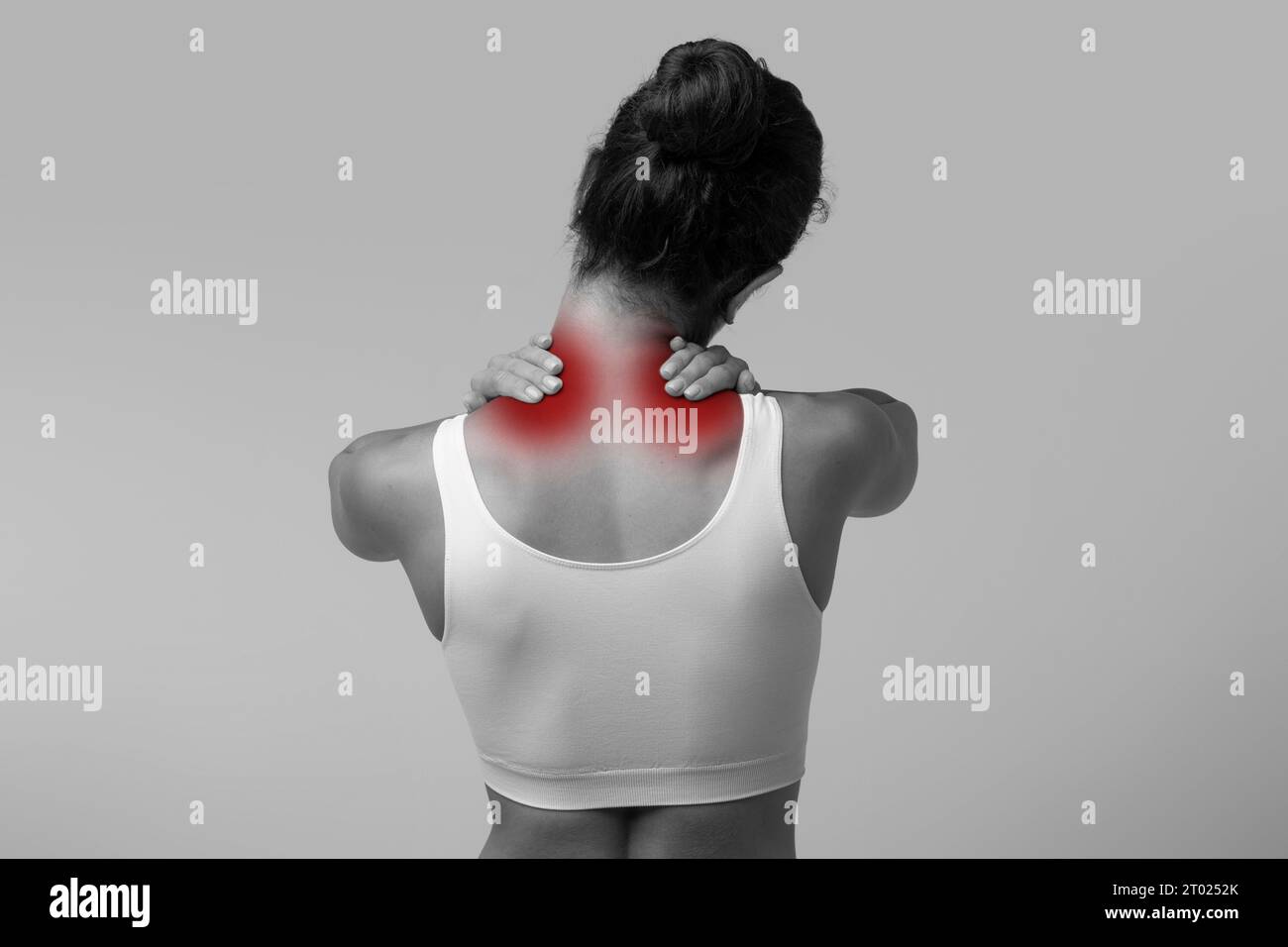 Unrecognizable woman suffering from pain, massaging neck Stock Photo ...