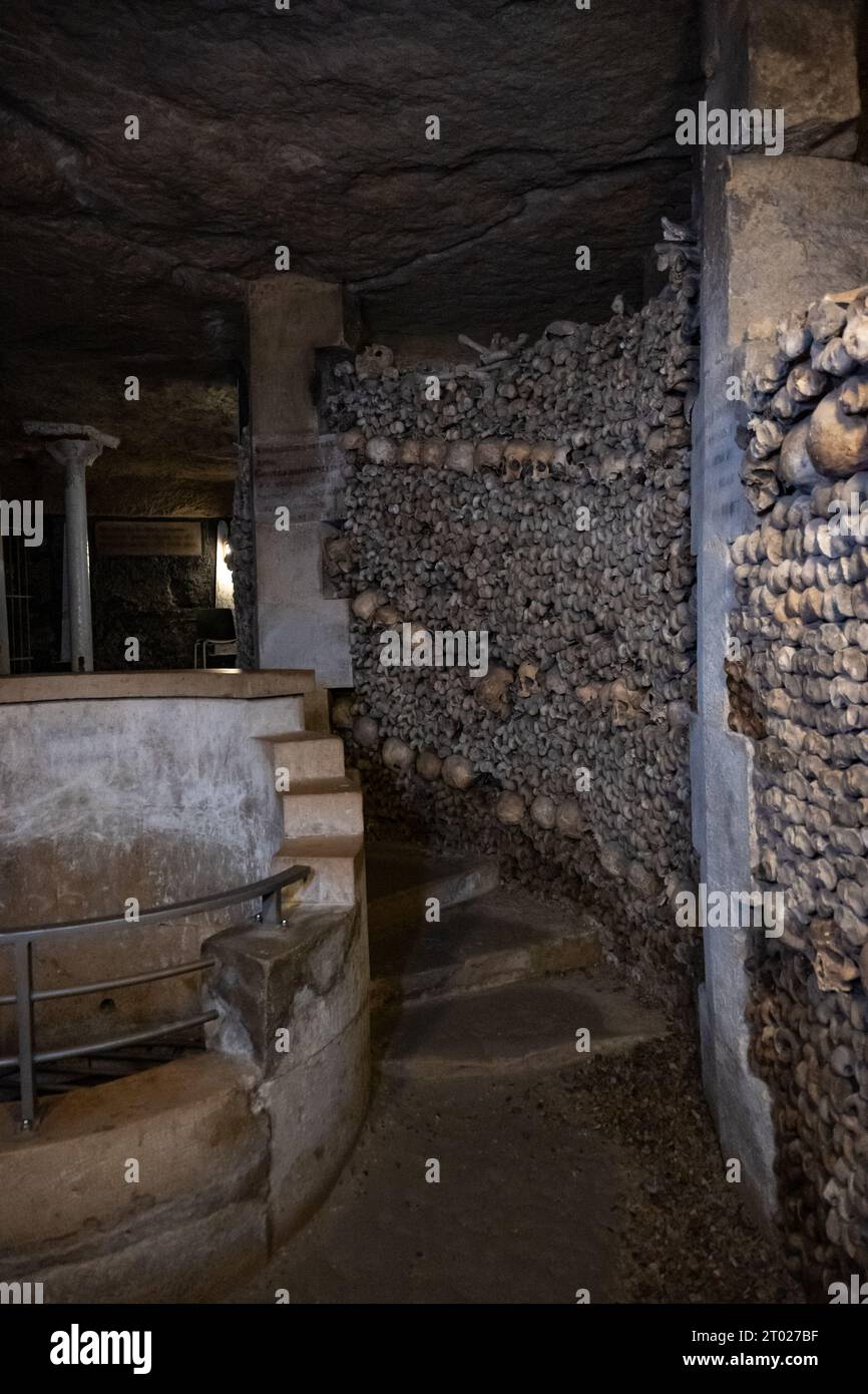 In the Paris Catacombs, a long underground path with structures formed by human bones, near Montparnasse, Paris, France Stock Photo