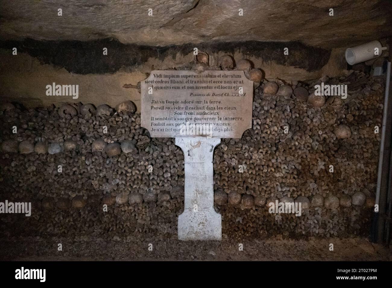 In the Paris Catacombs, a long underground path with structures formed by human bones, near Montparnasse, Paris, France Stock Photo