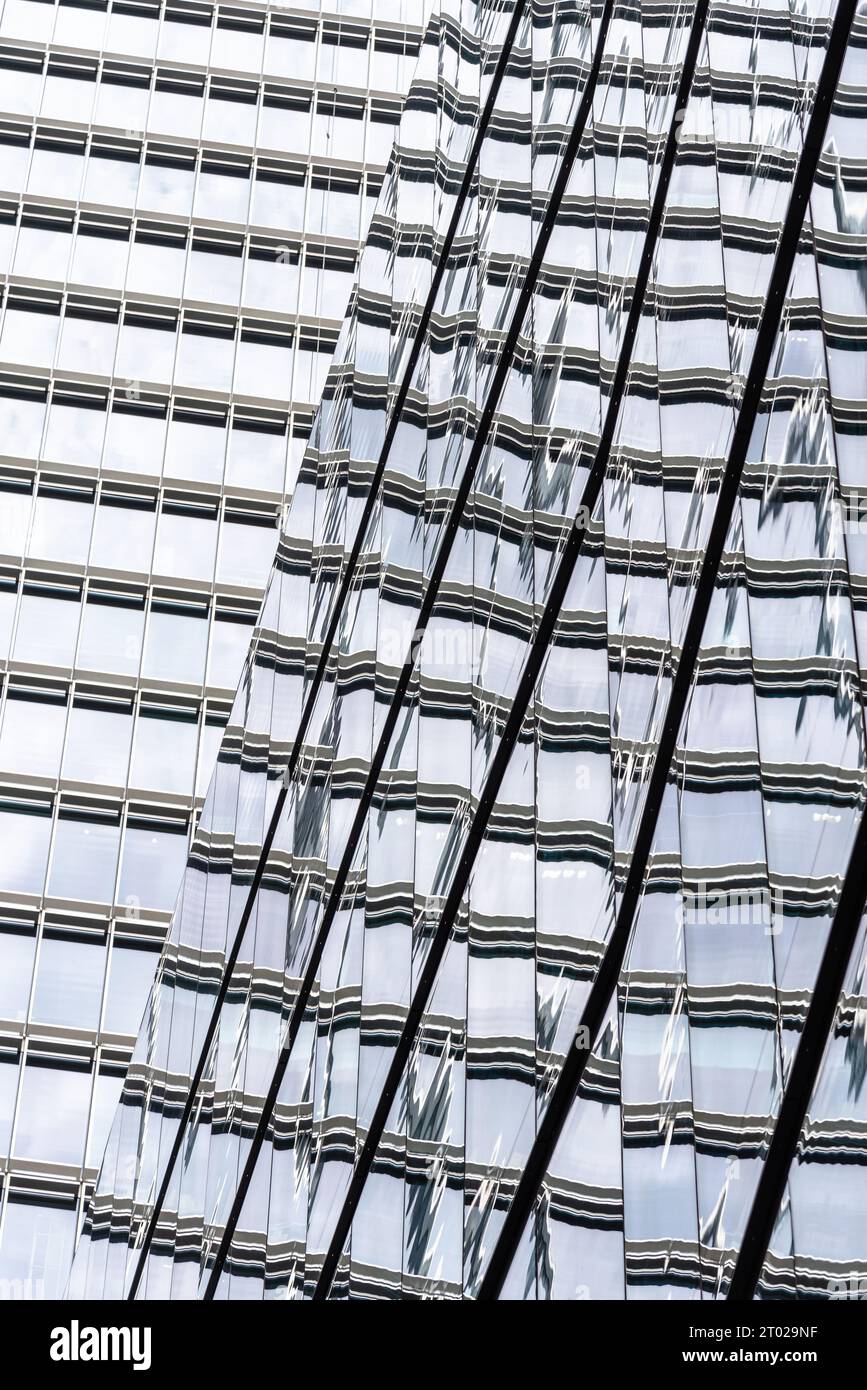 Abstract view of glass curtain wall in modern office buildings with reflections. Stock Photo