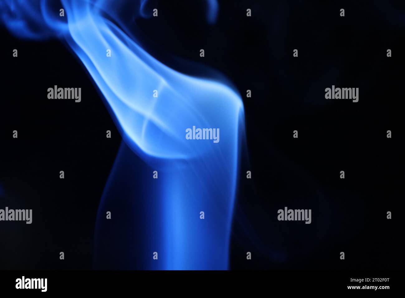 Blue smoke on a dark background, abstract pattern Stock Photo