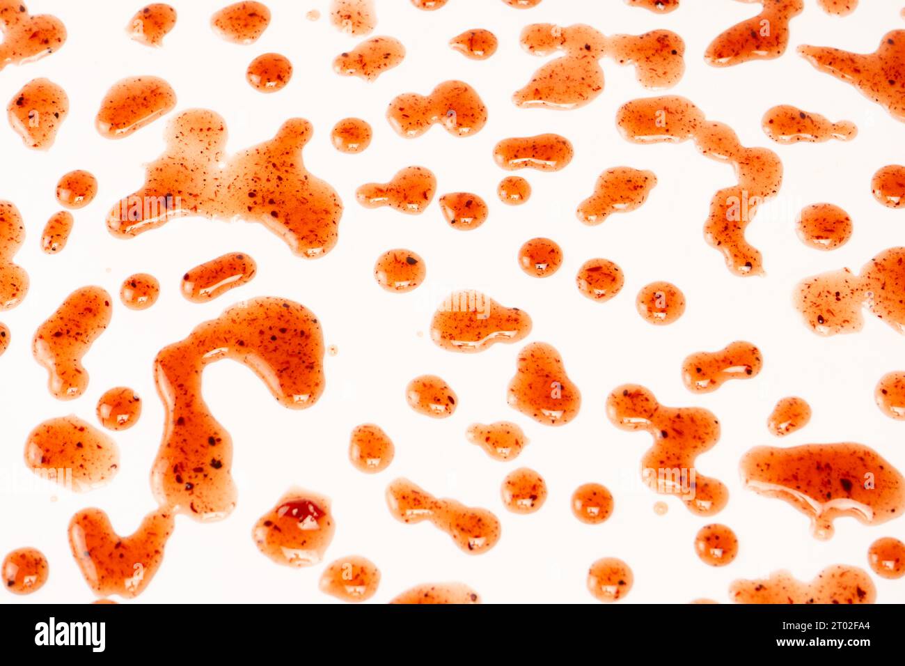 Red jam splashes isolated on a white background. Top view. Stock Photo