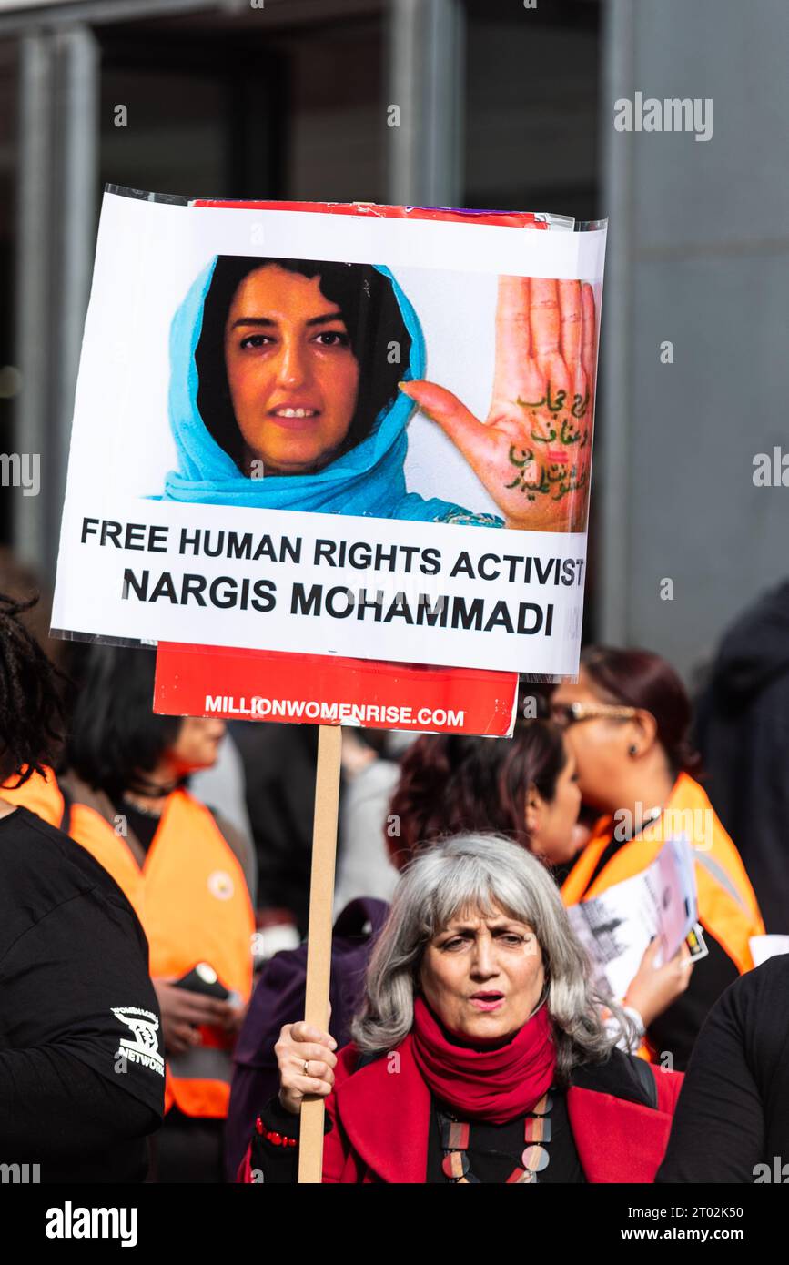 Placard at a Million Women Rise protest against male violence towards women in all its forms. London, UK. Iranian Nargis Mohammadi message Stock Photo