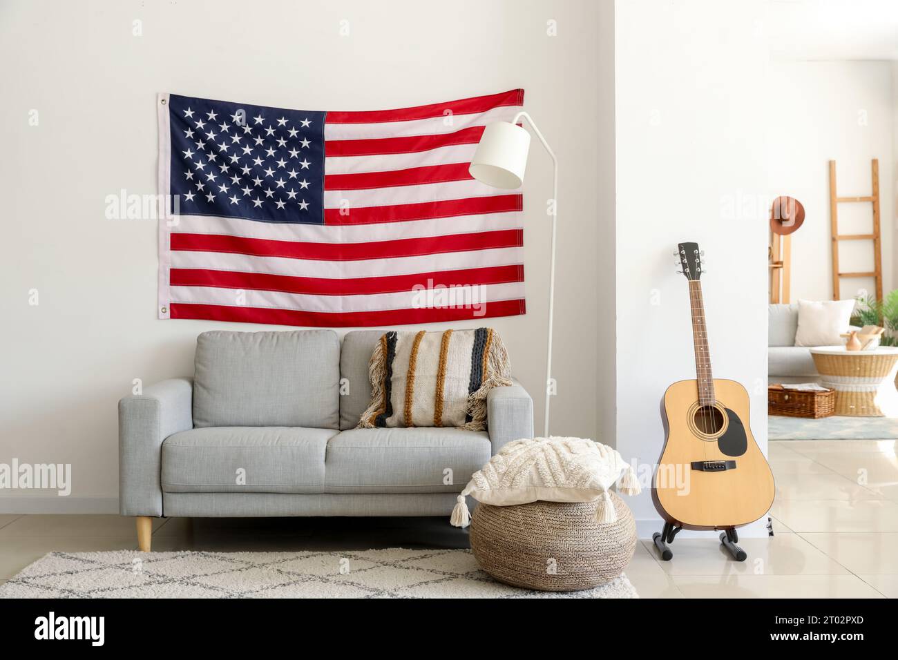 Interior of modern living room with hanging USA flag Stock Photo - Alamy
