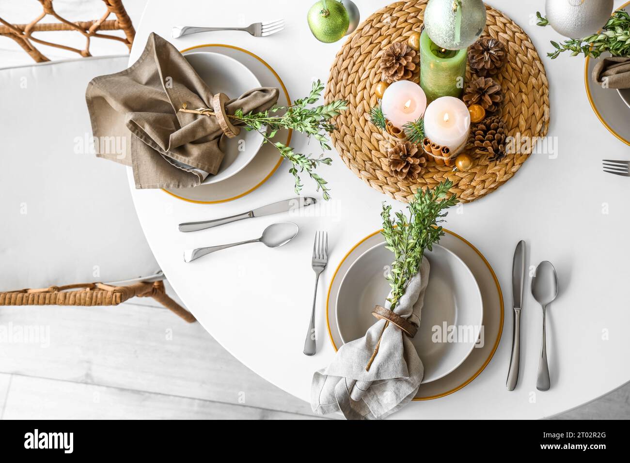 Christmas table setting with burning candles and pine cones Stock Photo ...