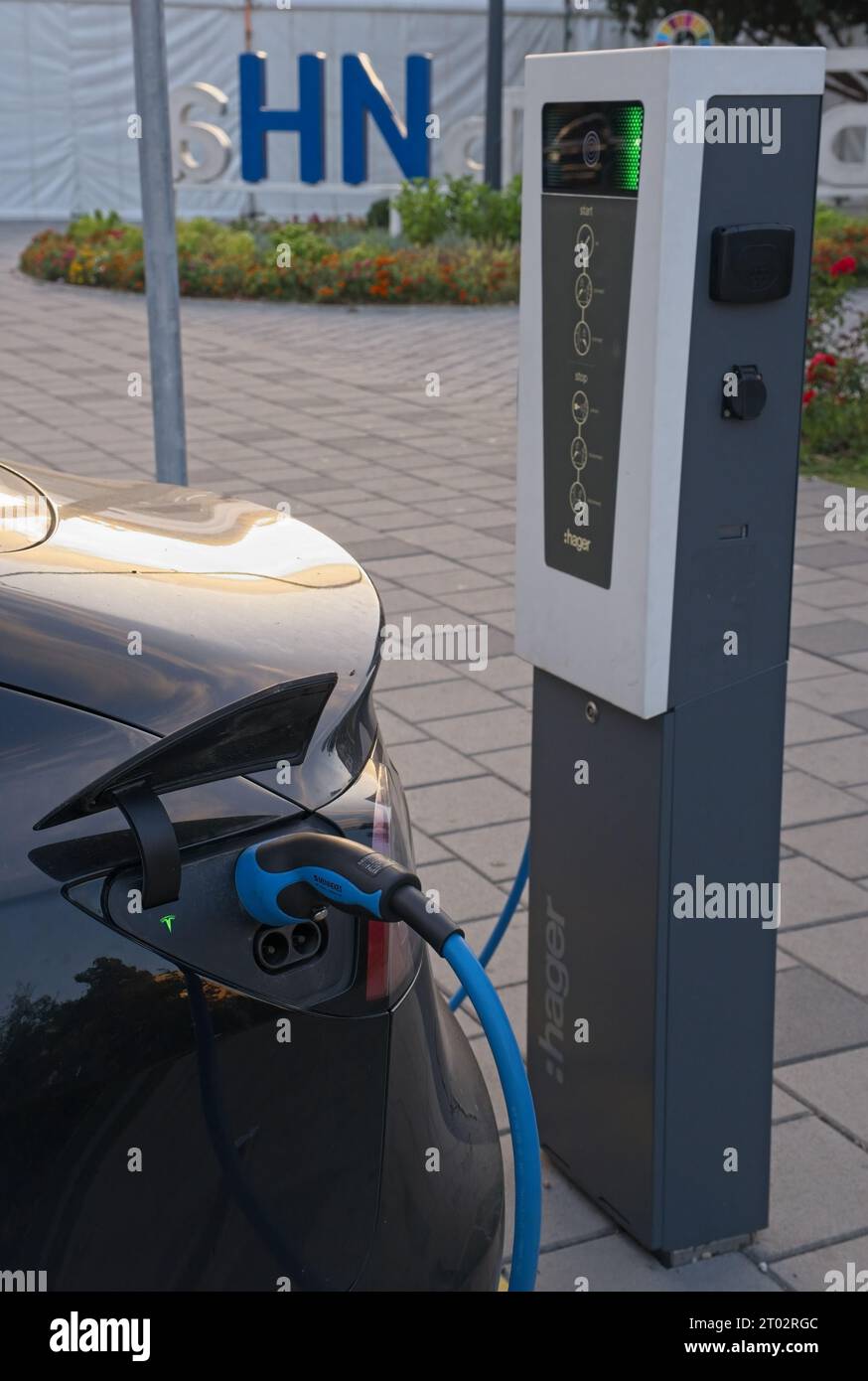 Bijeljina, Bosnia and Herzegovina - Oct 2, 2023: A static shot of electric car charging at the city hall AC charging station in a sunny autumn day. Stock Photo