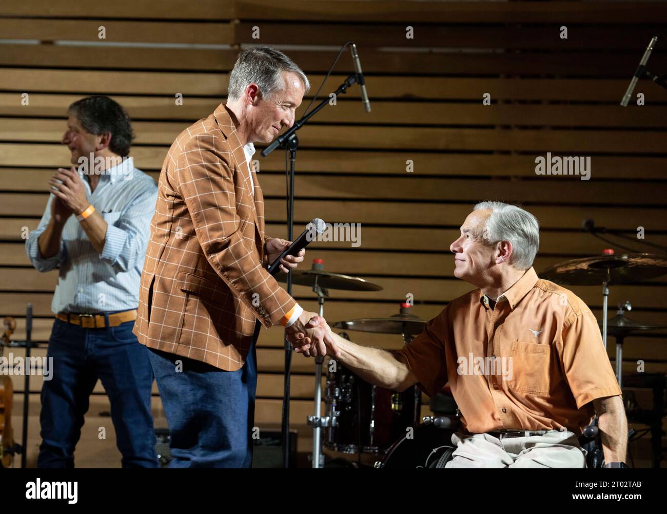 University of Texas President JAY HARTZEL (left) shakes hands with Governor GREG ABBOTT at a tailgate party hosted by Abbott the evening before a football game between undefeated Texas (4-0) and Kansas (4-0) in Austin on September 29, 2023. Several hundred Longhorn fans roamed the grounds and toured the governor's mansion. ©Bob Daemmrich Stock Photo