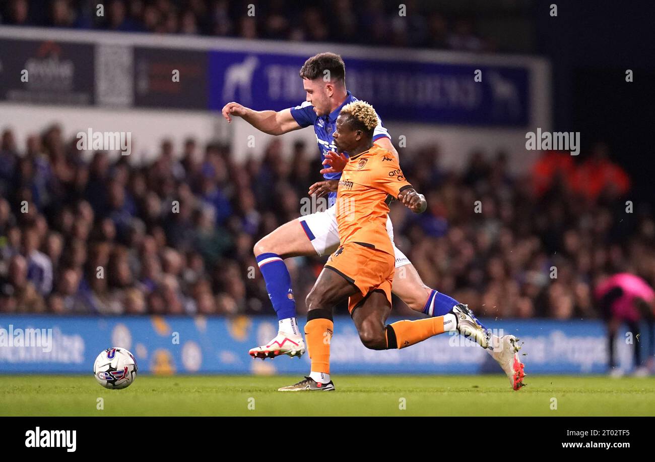 Ipswich Town's George Hirst (left) and Hull City's Jean Michael Seri battle for the ball during the Sky Bet Championship match at Portman Road, Ipswich. Picture date: Tuesday October 3, 2023. Stock Photo