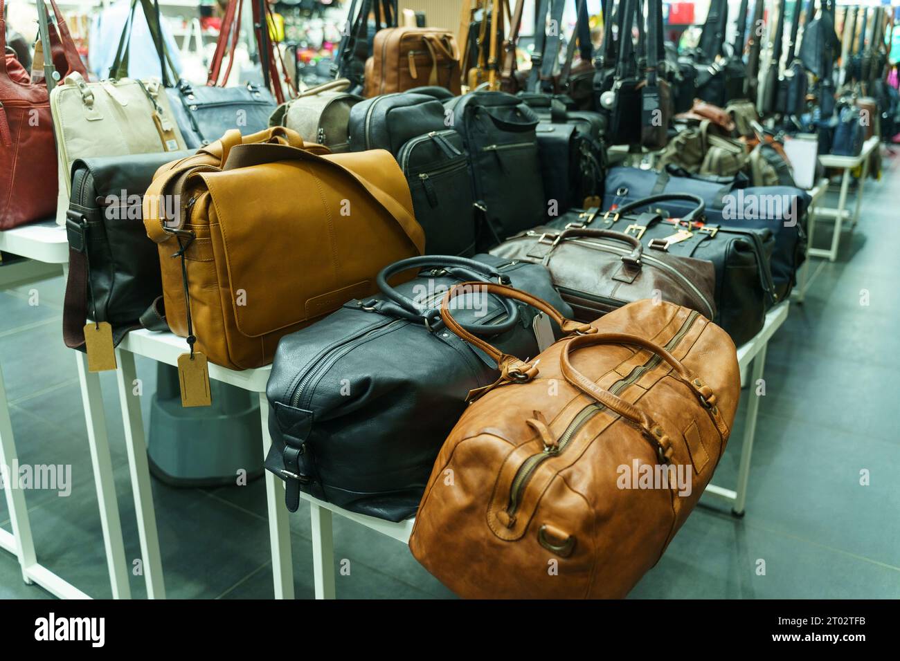 showcase of a store selling bags for travel and business trips plain leather bags background image 2T02TFB