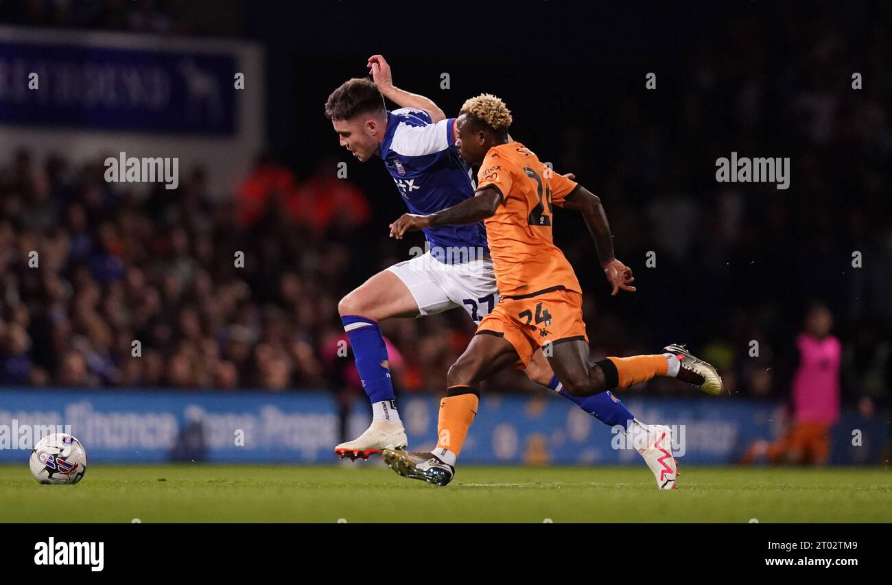 Ipswich Town's George Hirst (left) and Hull City's Jean Michael Seri battle for the ball during the Sky Bet Championship match at Portman Road, Ipswich. Picture date: Tuesday October 3, 2023. Stock Photo