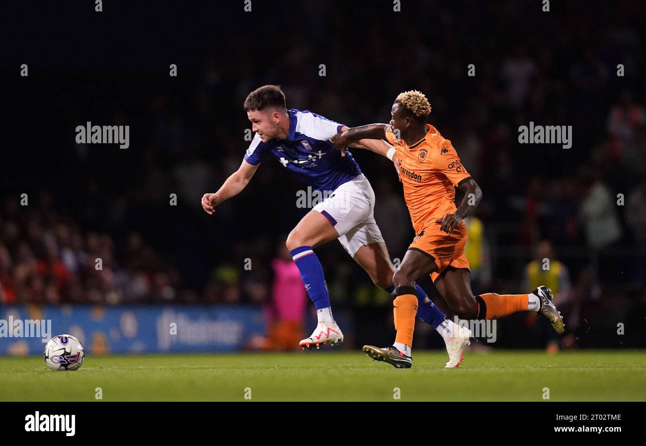 Ipswich Town's George Hirst (left) and Hull City's Jean Michael Seri battle for the ball during the Sky Bet Championship match at Portman Road, Ipswich. Picture date: Tuesday October 3, 2023. Stock Photo