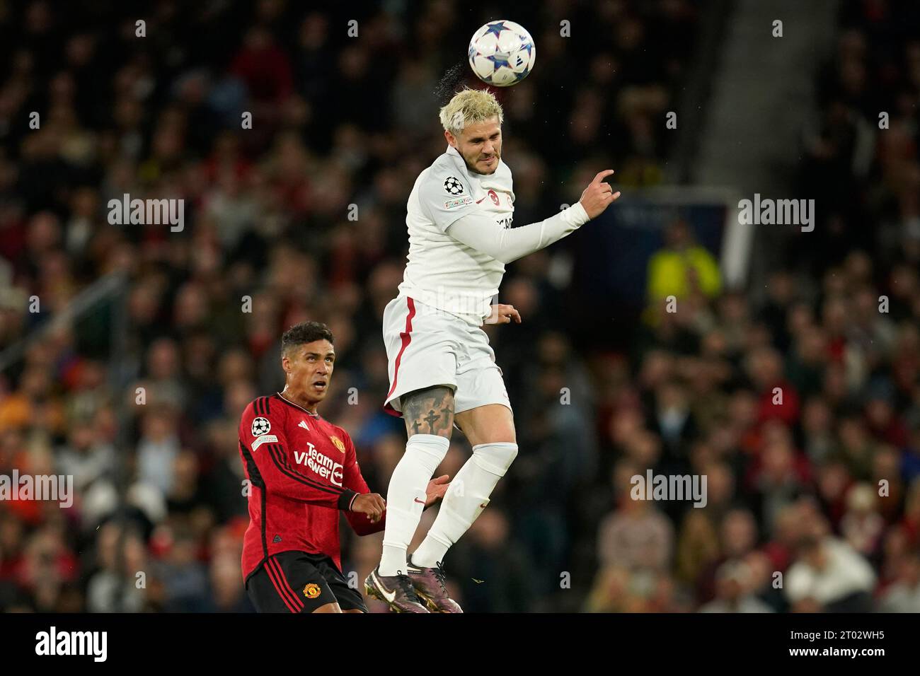 Galatasaray's Mauro Icardi, top, heads the ball with Manchester