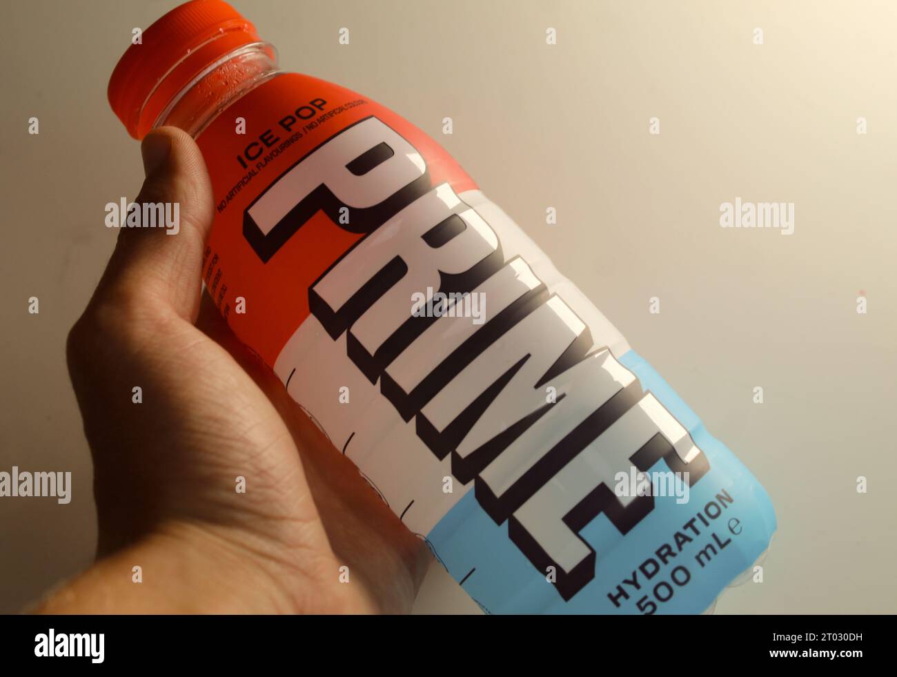 A photo of a Prime Hydration Ice Pop Drink Bottle. Stock Photo