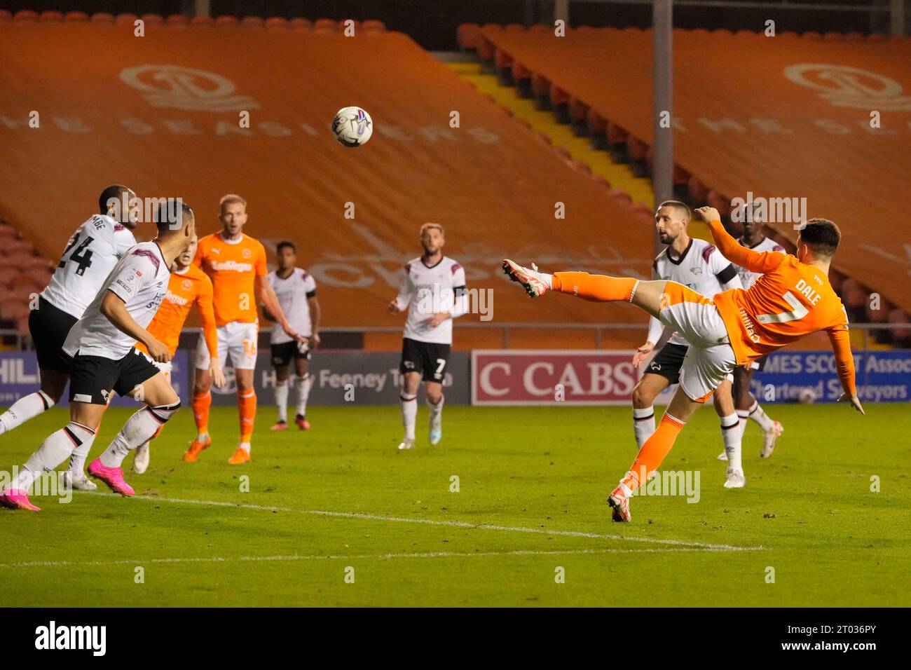 Owen Dale 7 of Blackpool heads back across goal during the Sky Bet