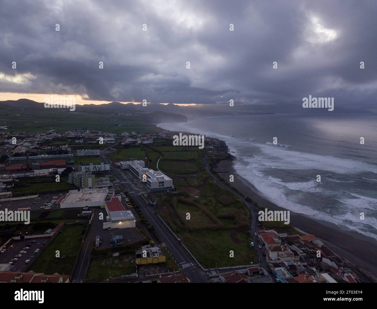 Aerial view of the city of Ribeira Grande and is shore line on a cloudy end of day. Sao Miguel island in the Azores. Stock Photo