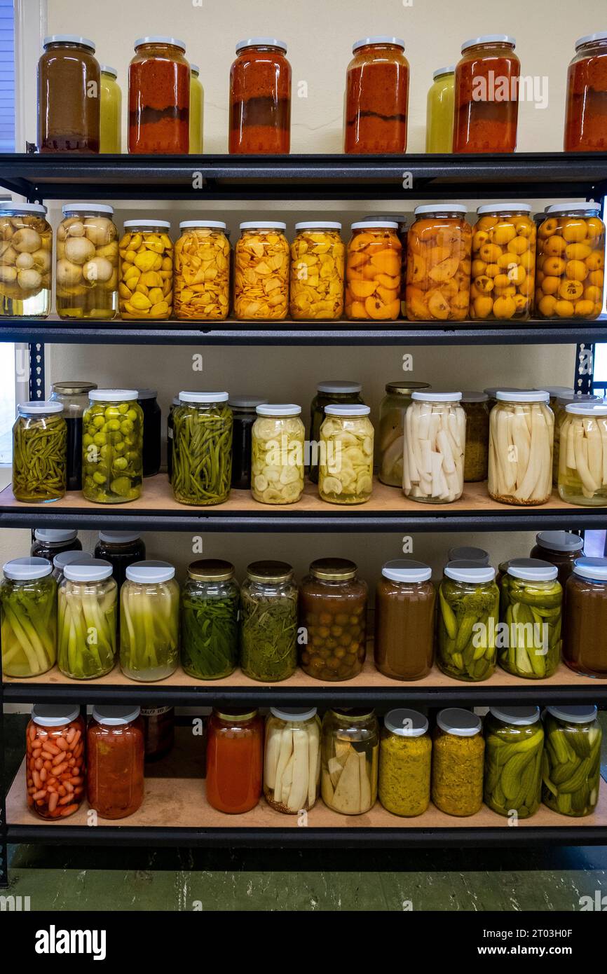 A rack of bottled fruit, preserves and pickles at the Agrarian Kitchen restaurant at New Norfolk in Tasmania's Derwent Valley Stock Photo