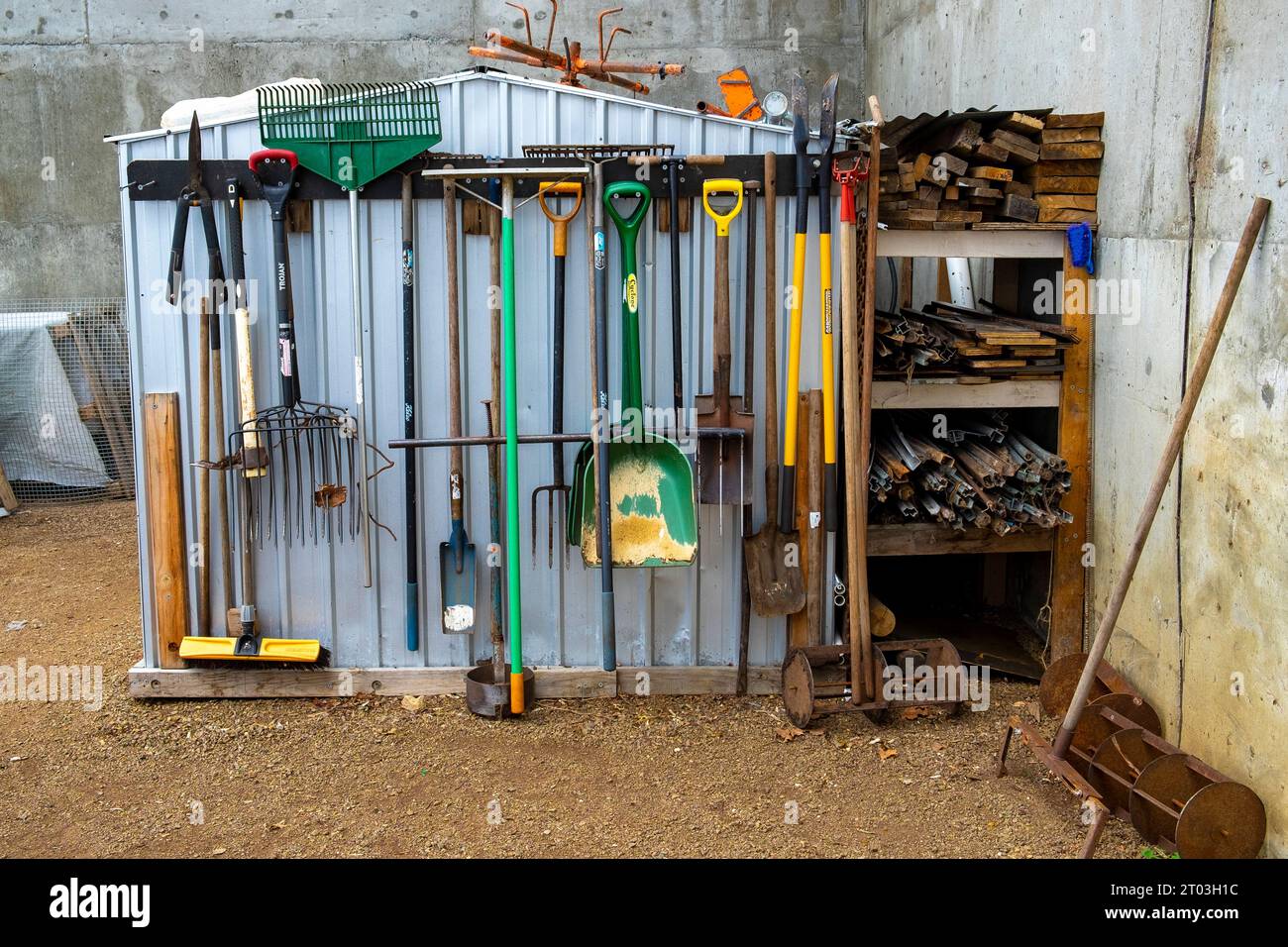 A well-ordered array of garden tools at the Agrarian Kitchen garden at Willow Court, New Norfolk, shovels, spades, forks and rakes at Norfolk in the Derwent Valley, Tasmania. Stock Photo