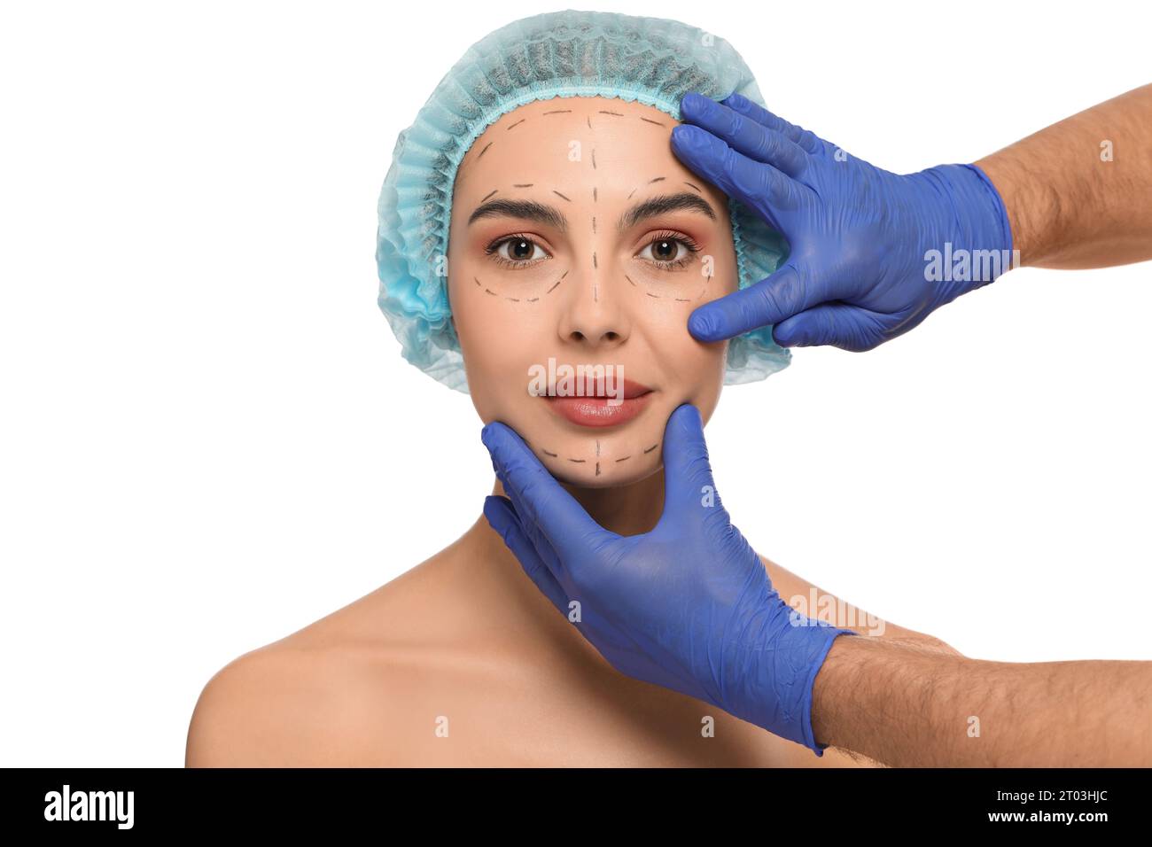 Doctor checking patient's face before cosmetic surgery operation on