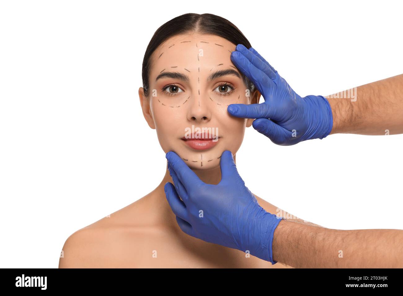 Doctor checking patient's face before cosmetic surgery operation on