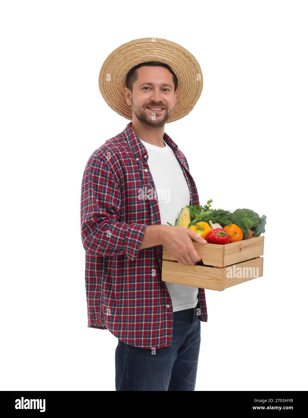Harvesting season. Happy farmer holding wooden crate with vegetables on ...