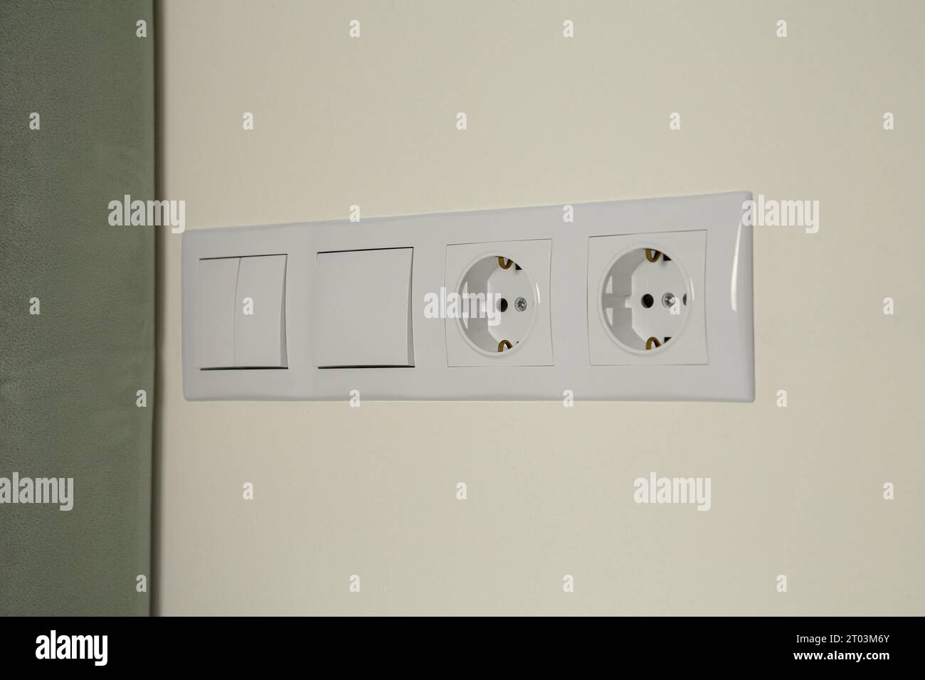 Light switches and power sockets on white wall indoors Stock Photo Alamy