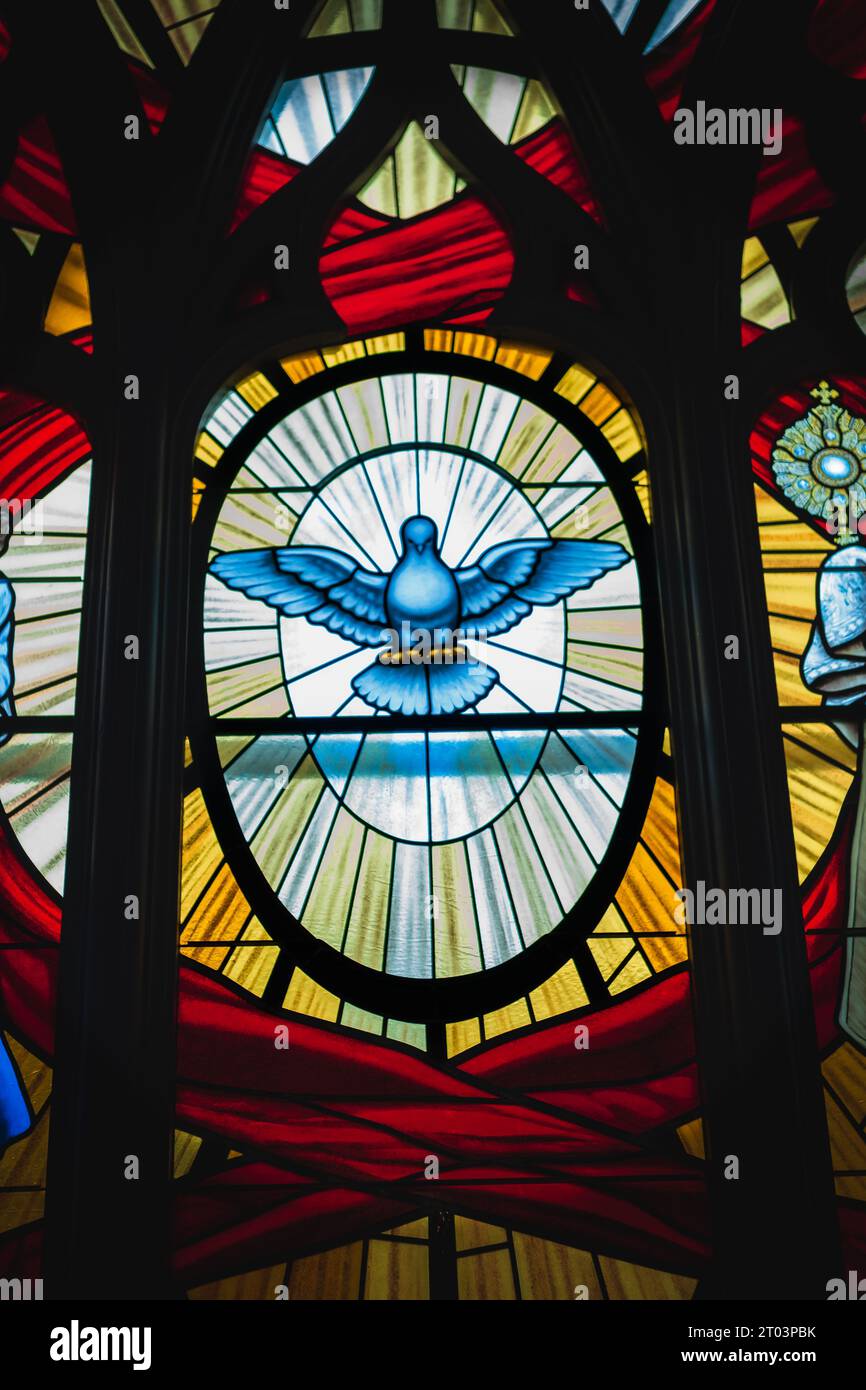 Decorative church stained glass window with dove. suncatcher stained
