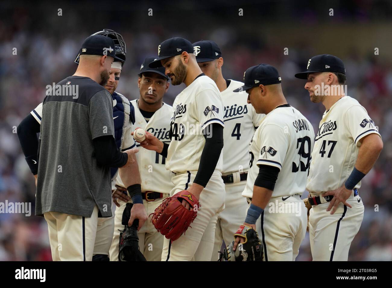 Minnesota Twins starting pitcher Pablo Lopez, center, hands the game ...