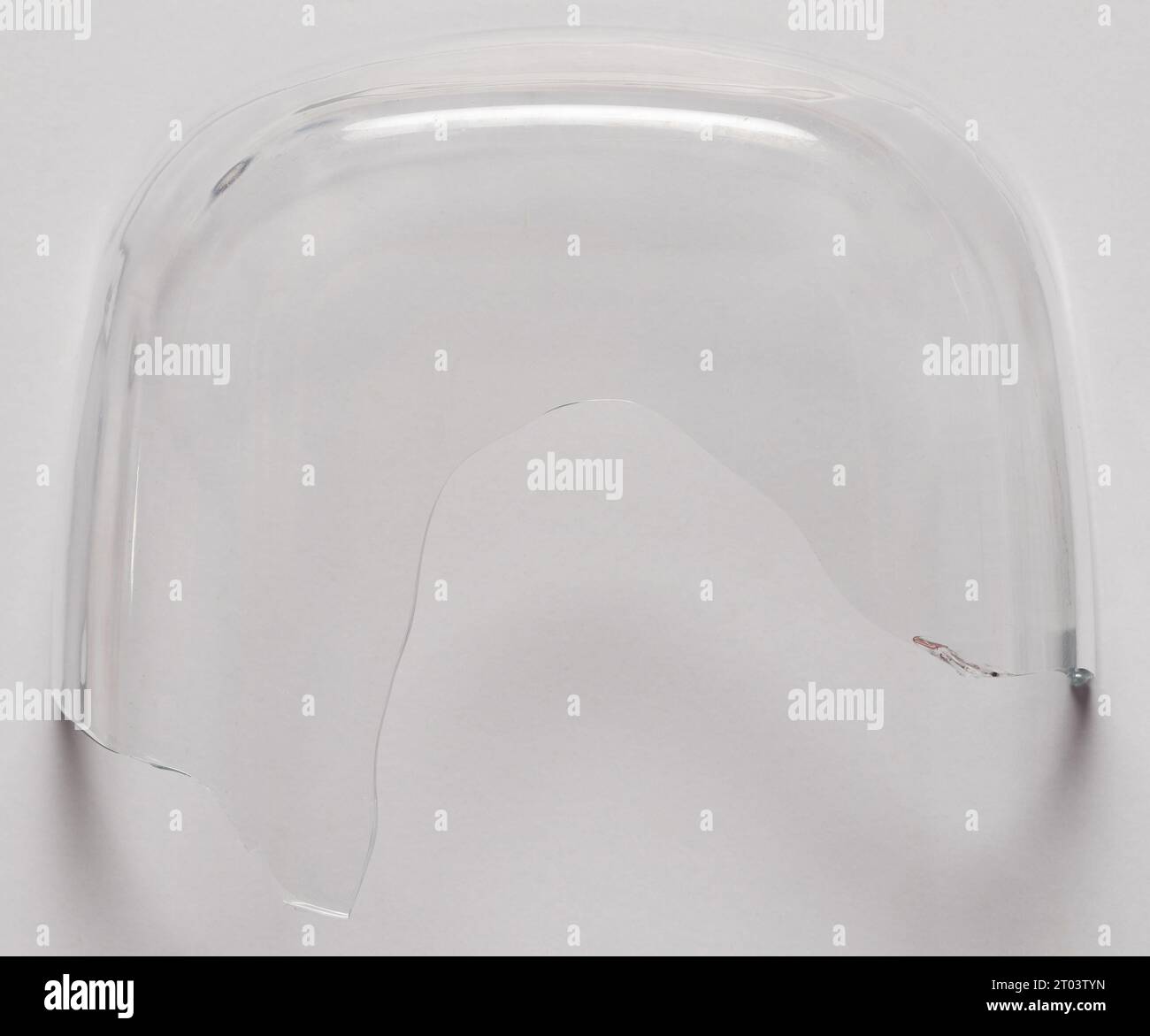 Sharp broken transparent bowl piece isolated  on studio background Stock Photo