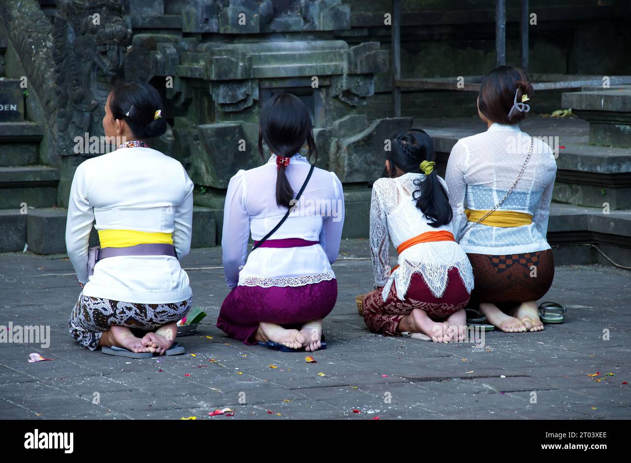 Women praying in Goa Lawah HinduTemple, Bali, Indonesia Stock Photo