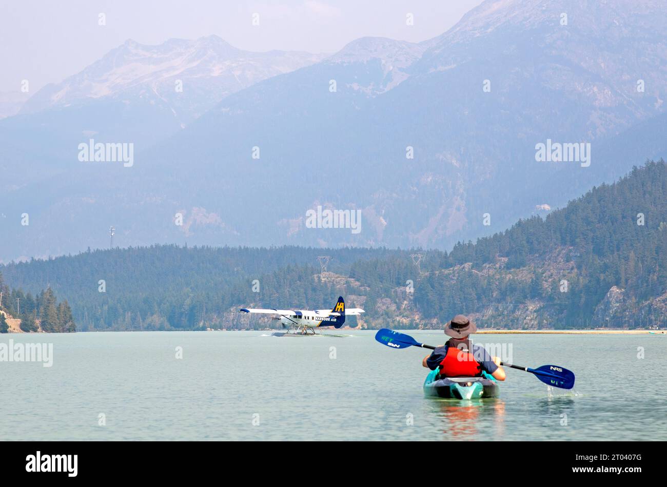 Kayak and seaplane on Green Lake, Whistler Stock Photo