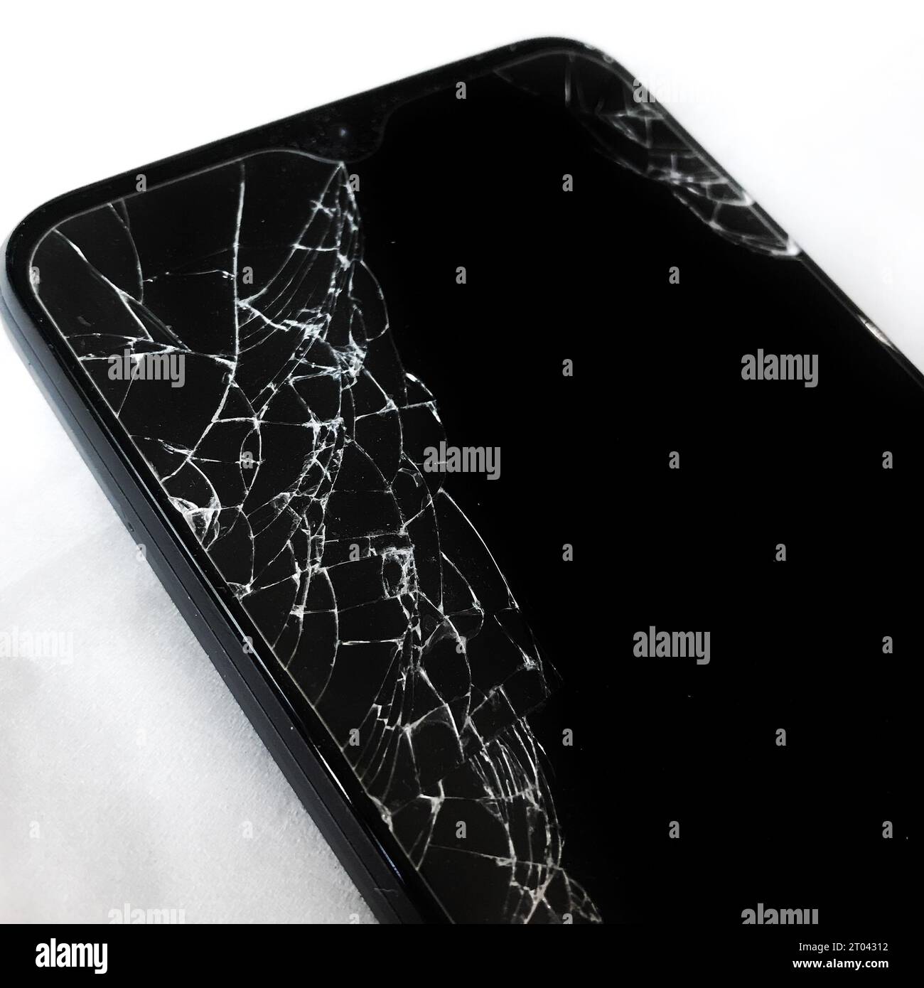 The phone screen cracked from falling on the floor Stock Photo Alamy