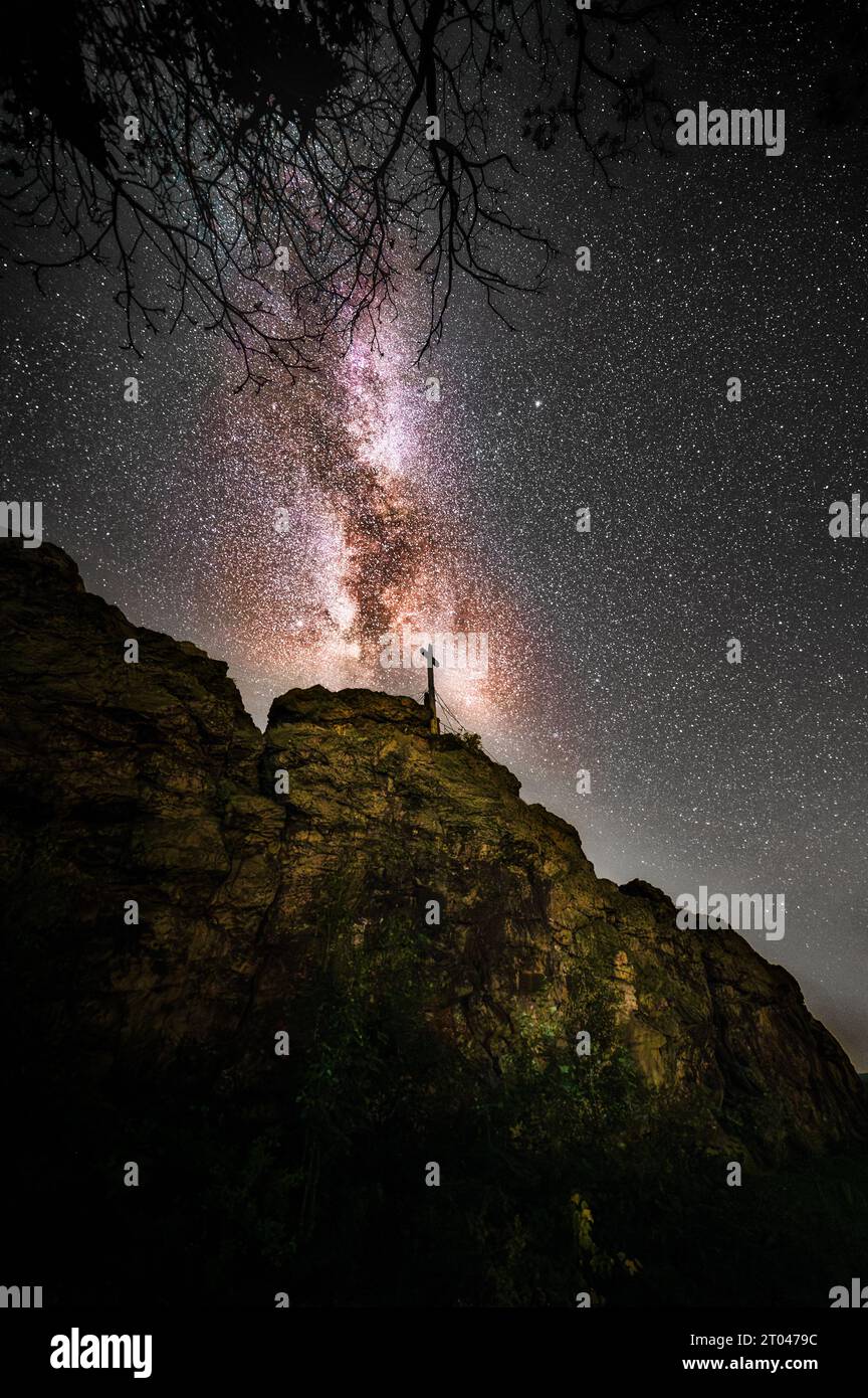 Beautiful and colorful Galaxy Milky Way over the 'Großer Gegenstein' at night in Germany, Ballenstedt Stock Photo